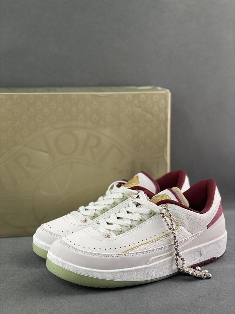 Air Jordan 2 Retro Low A Ma Maniére 'Airness' Sail Burgundy Crush White Maroon Gold Green DO4055-161 Limited Edition Collaboration Sneakers